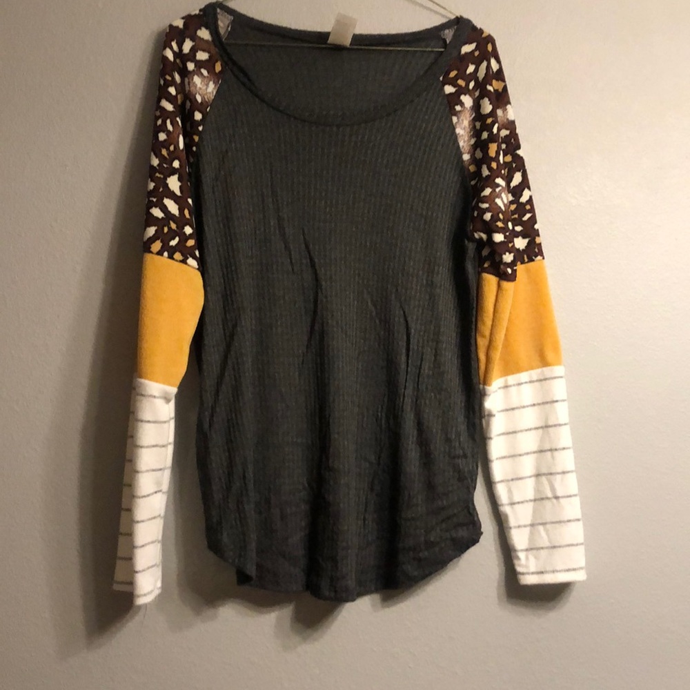 Gray with leopard and yellow.  Never worn. Size M